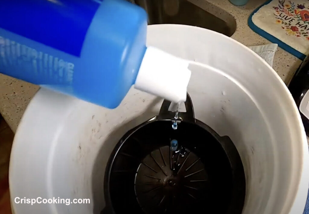 Liquid Cleaner inside Bucket to clean removal parts of coffee maker