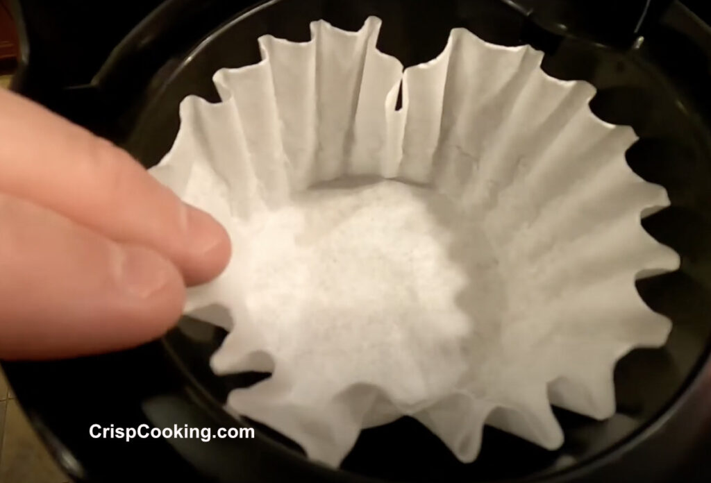 Place a new paper coffee filter