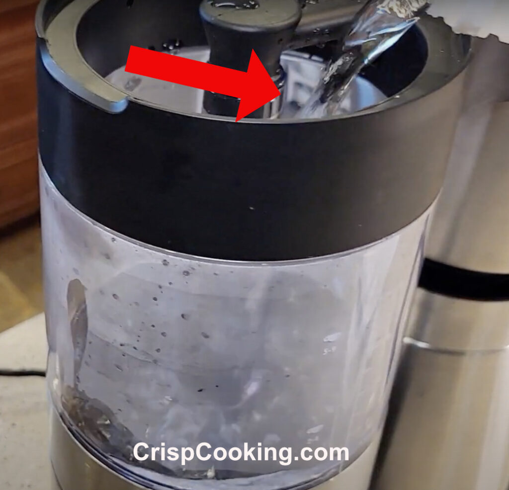 Pour the white vinegar in OXO coffee maker water reservoir