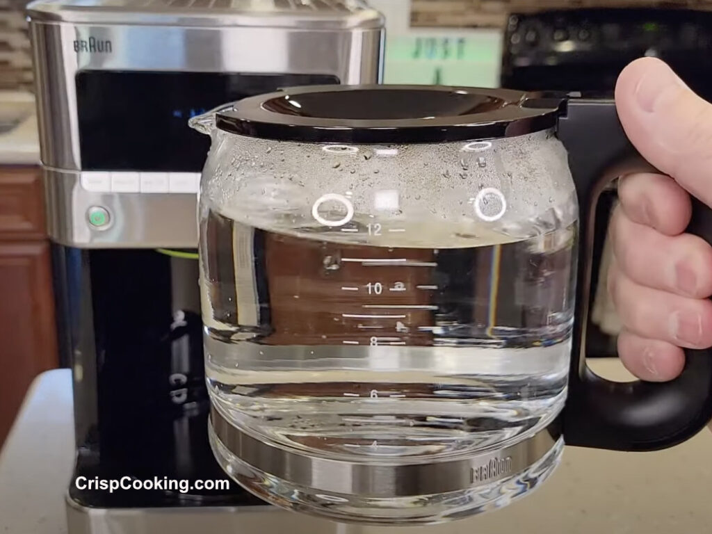 Remove Braun coffee pot and discard water