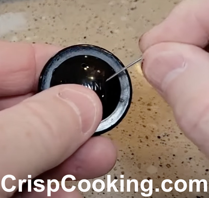 Cleaning Bunn coffee maker brew head with paper clip