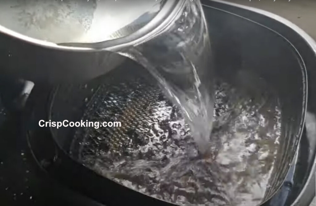 Add hot water to Philips air fryer pan