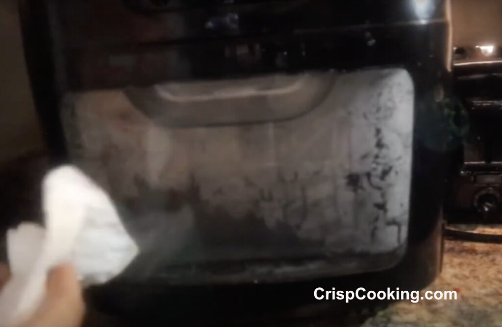 Clean outside of chefman air fryer with paper towels